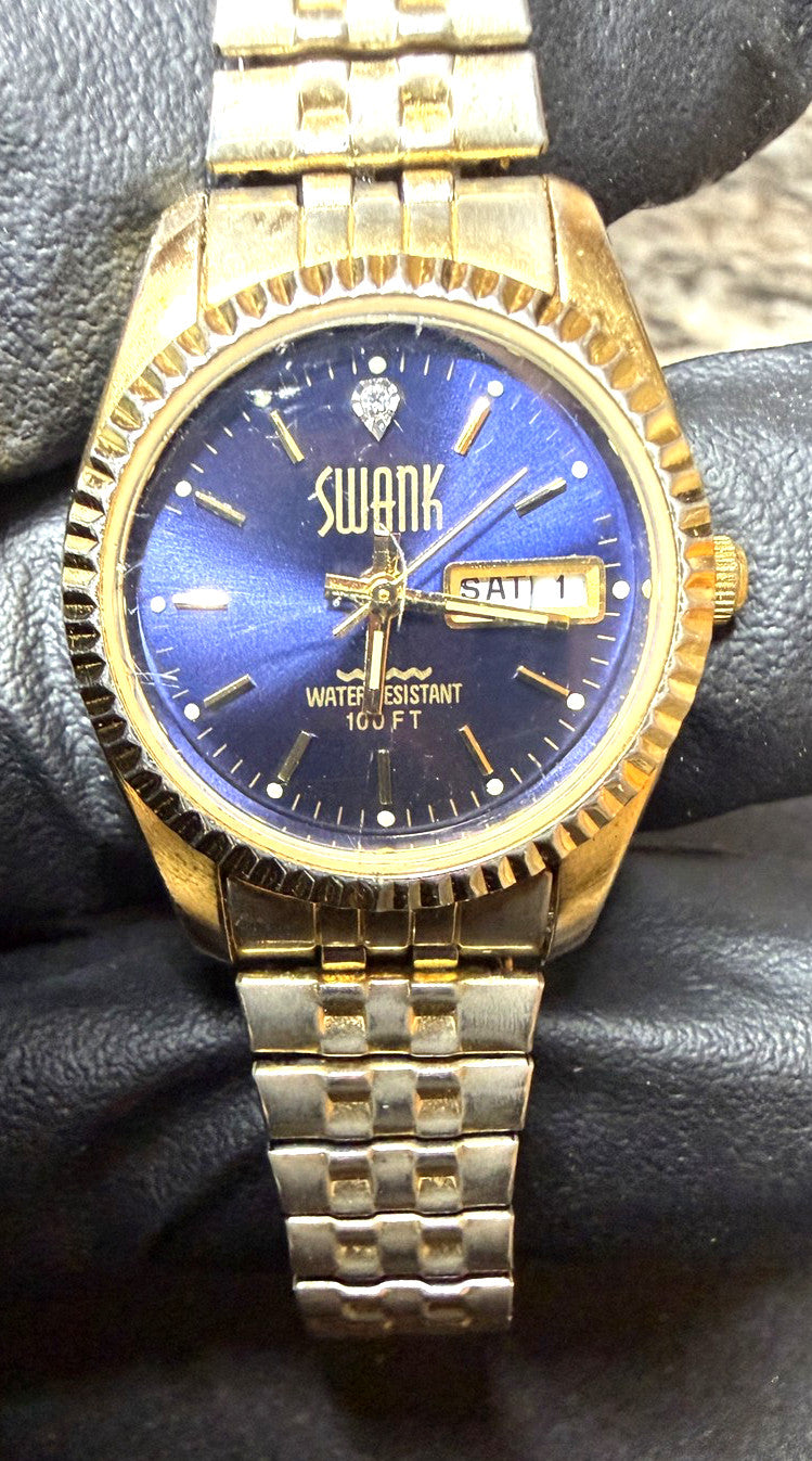 SWANK FM295 Mens Watch Gold Tone Blue Dial Day Date Two-Tone Diamond Accent